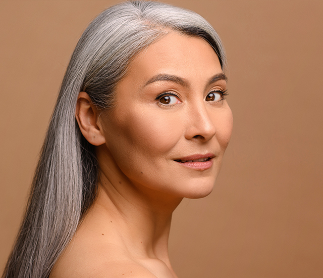 Serene middle-aged Asian woman