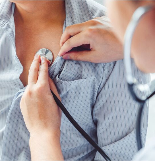 Patient with physician checking heart