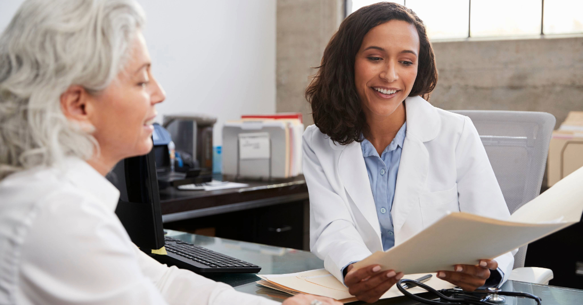 Female provider discussing treatment plan with female middle-age patient