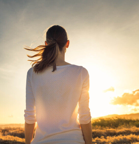 woman reflecting at sunset